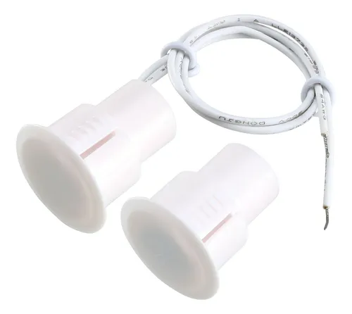 Sensor Magnético Empotrable RC-36 NC sensor magnético RC-36 empotrable mostrando sus dos partes (sensor e imán), utilizado para detección de apertura en puertas y ventanas.